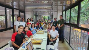 UP Diliman vendors sit around a table after a successful training.